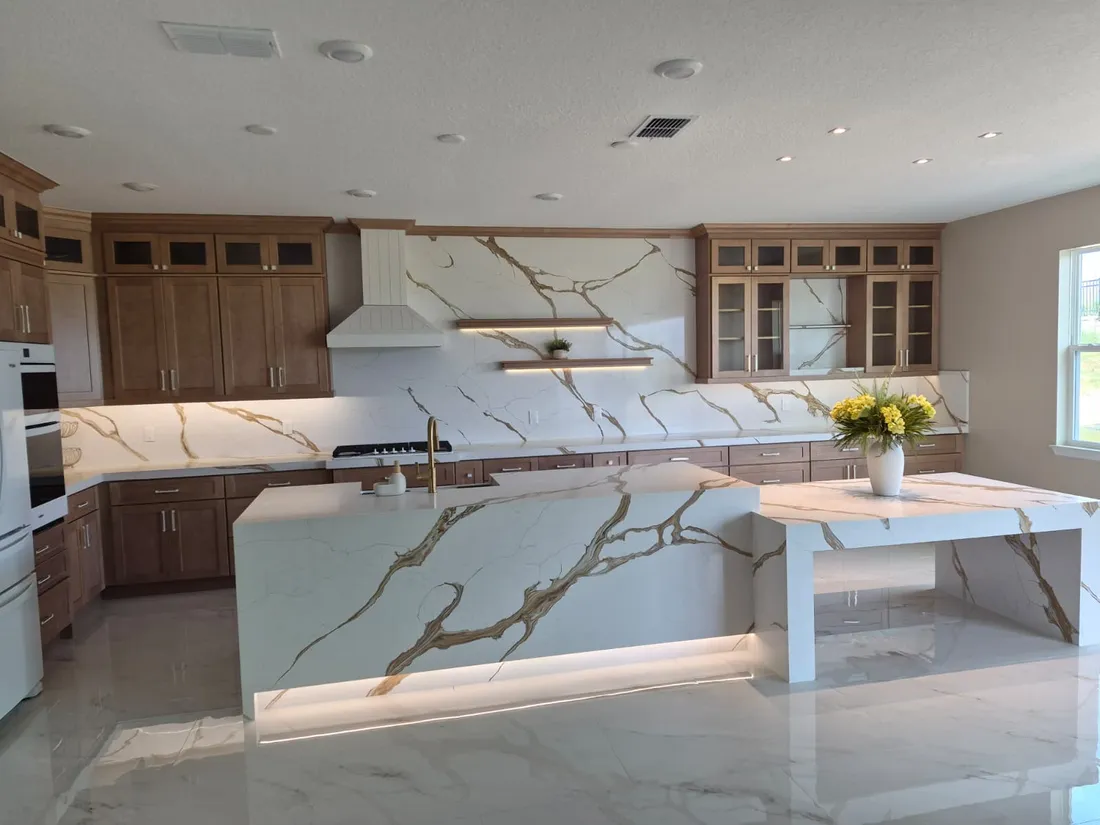Kitchen with a stone backsplash running the full height to the cabinets