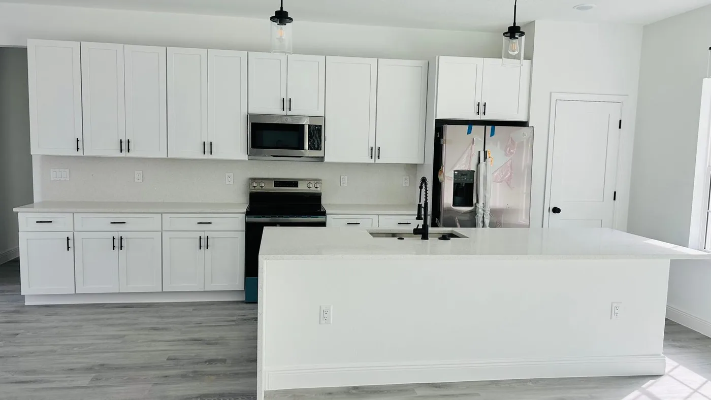 Davenport kitchen with a white island and light countertops
