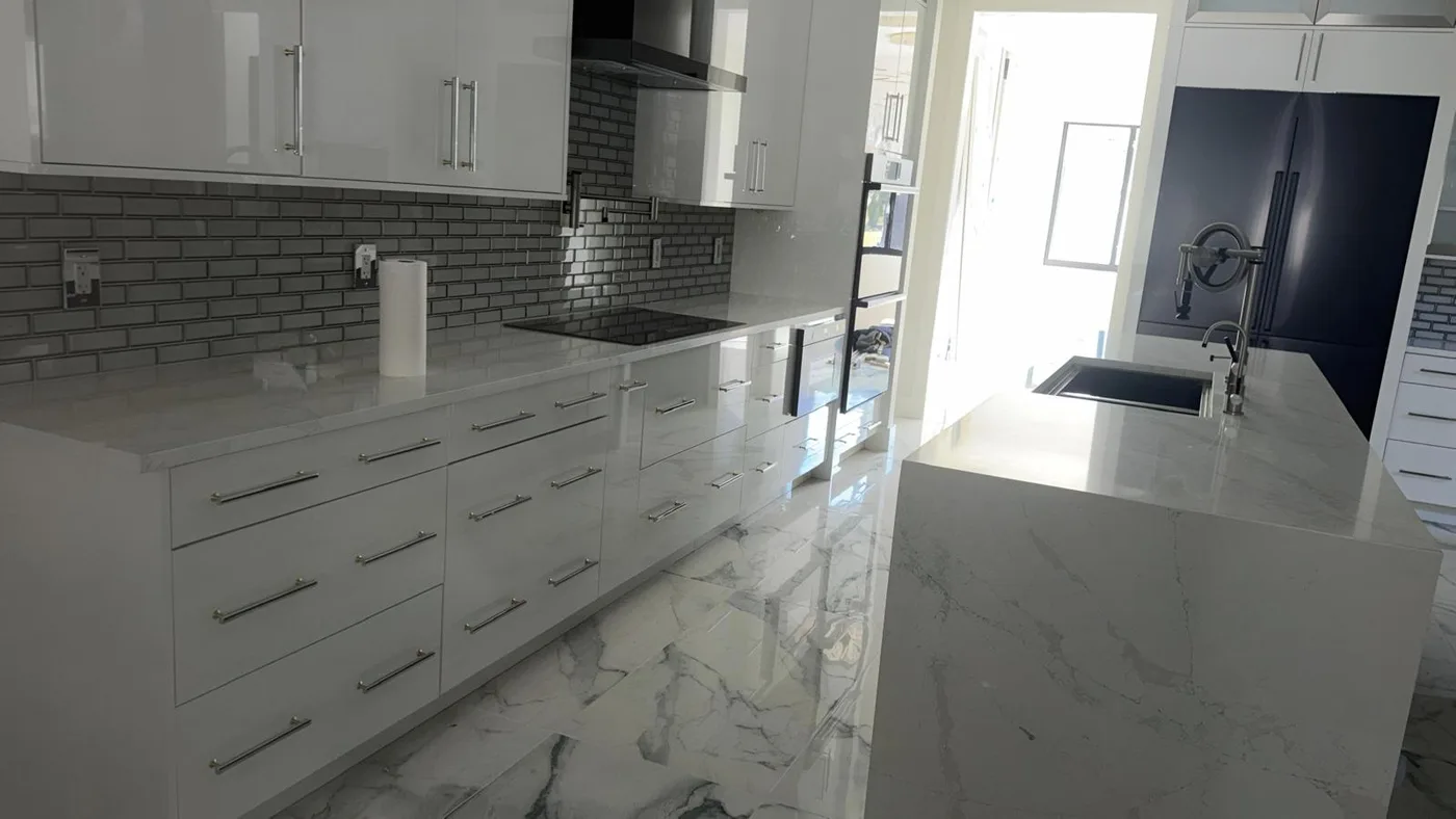 Winter Park kitchen with a stone counter and a full height splash