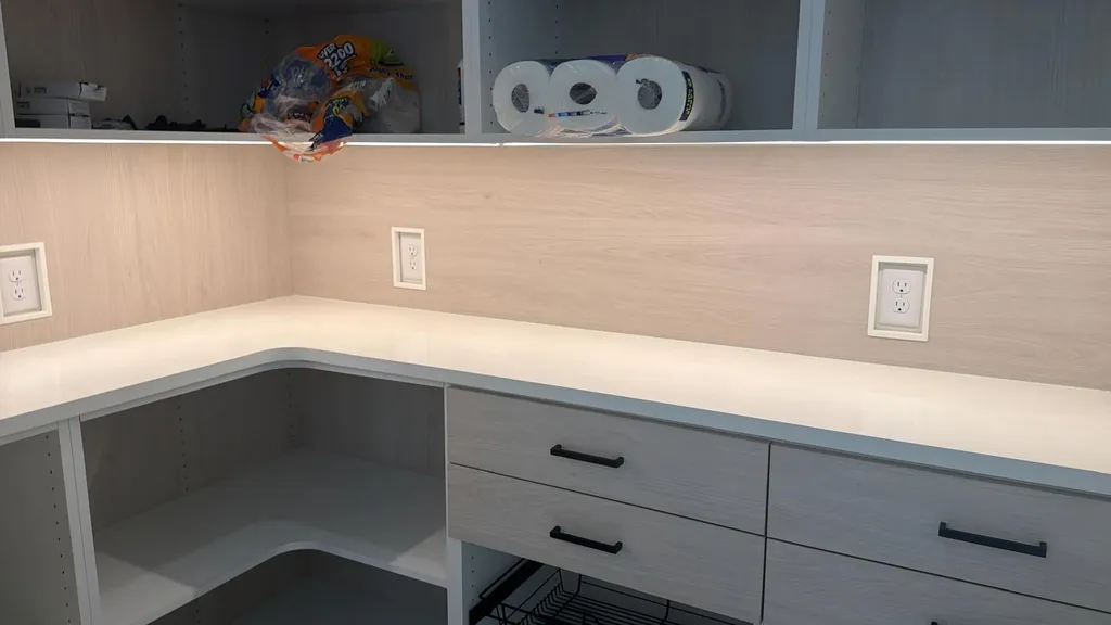 L shaped kitchen counter with a stone top and matching splash